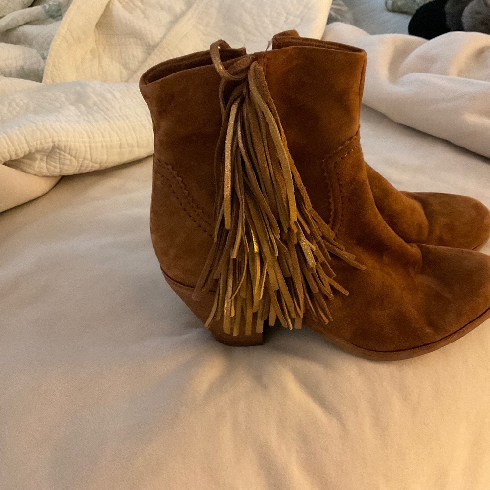 Sam Edelman suede bootie heels with brown and shiny gold tassels.
